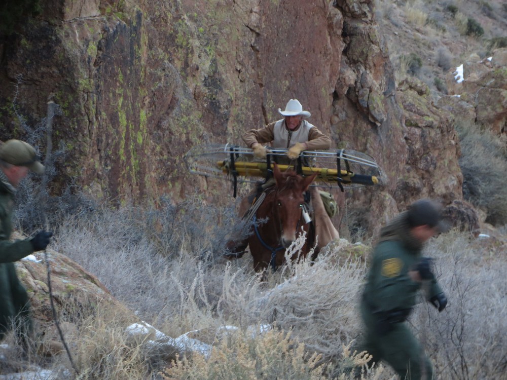 2 Warner arriving at sundown with a stretcher he had ridden a mile to get from Billy Darnell..JPG